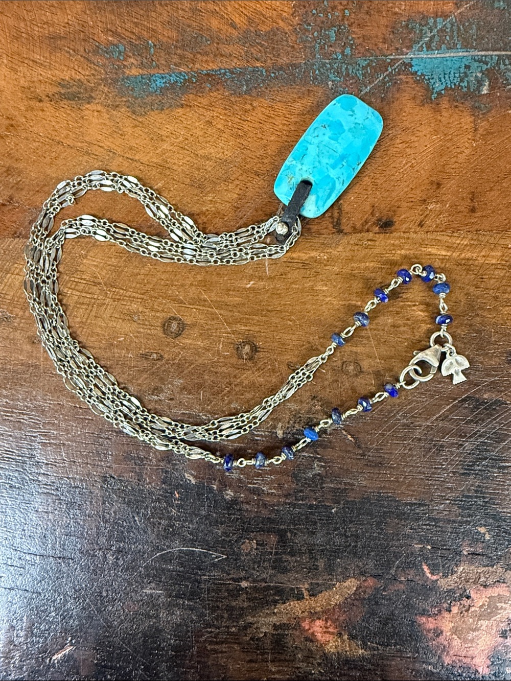 Peyote Bird Turquoise leather pendant on 3 strand silver chain. New with tags.